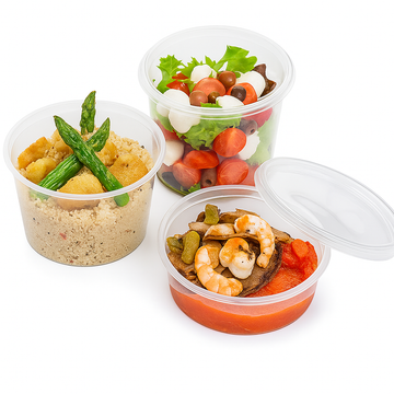 Vaschette di plastica tonde con coperchio, dimensioni diverse, piene di cibo